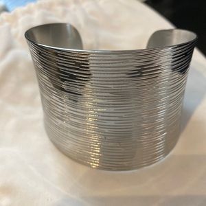 Stainless steel brushed cuff bracelet.